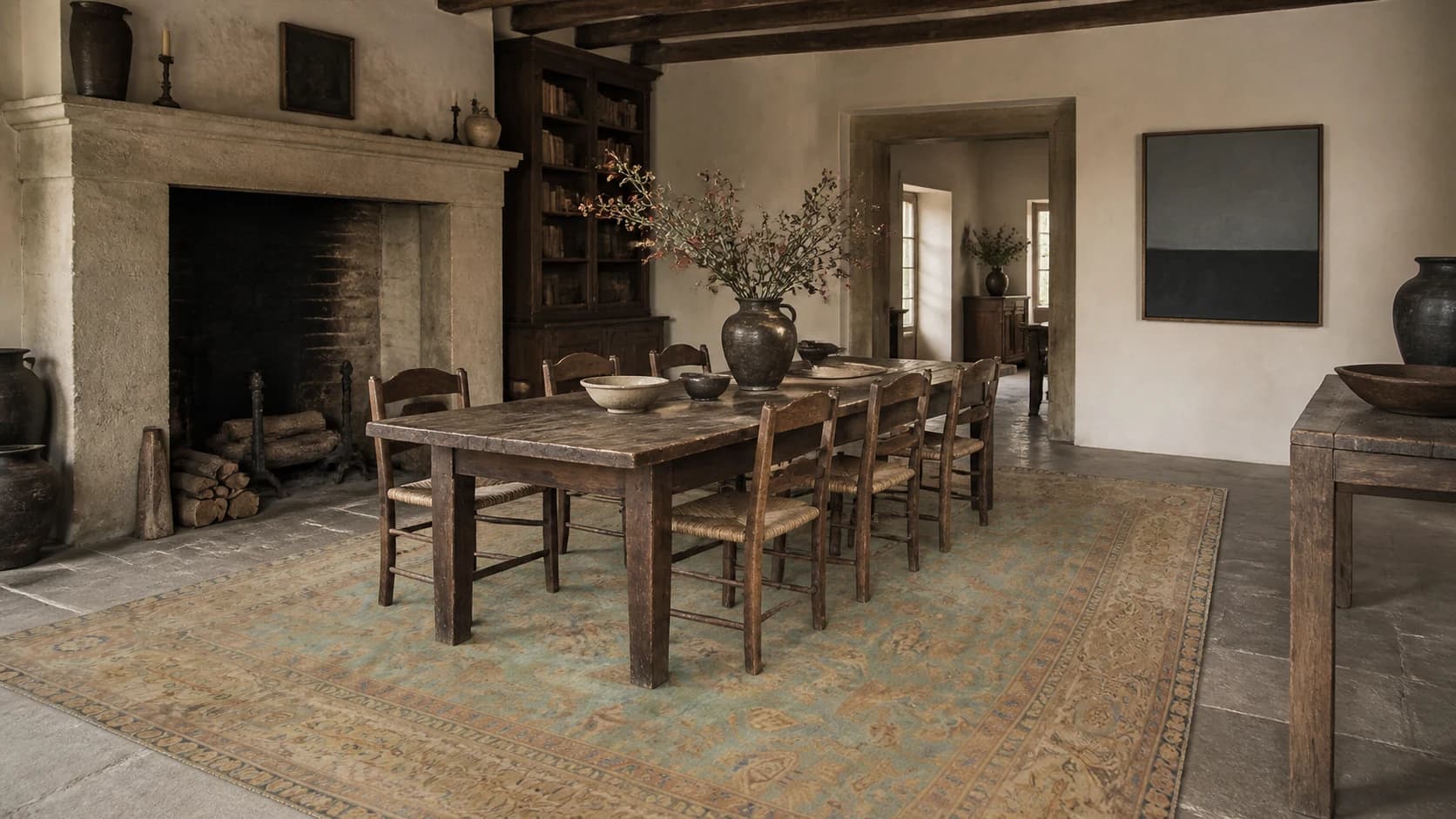 Mineral green and blue Agra rug beneath a long timber dining table